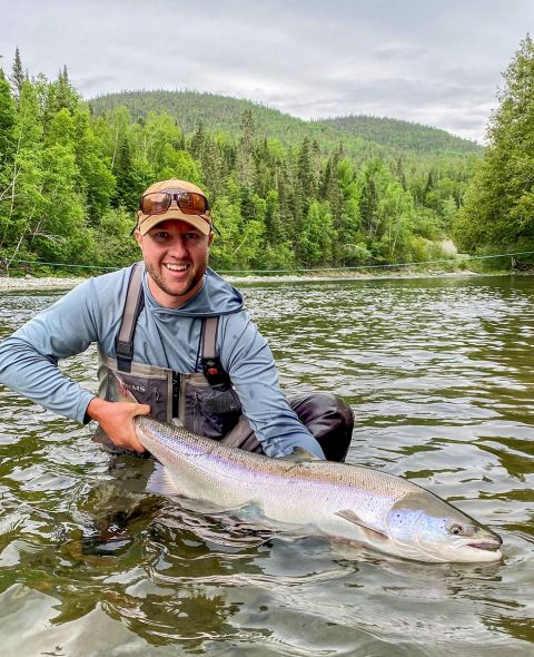 990-Colin-Huff-releases-a-typical-Cap-Chat-River-salmon-photo-Emily-Rogers